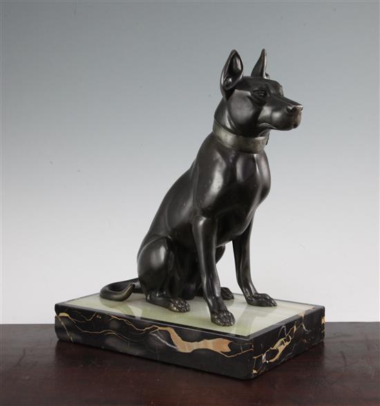 A French Art Deco patinated bronze model of a seated hound, 13.25in.